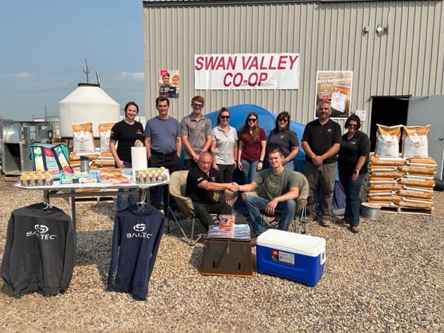 The Swan Valley Agro team presents winner Austin Spencer with his winnings.